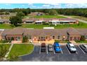 Scenic aerial view of the condo community showcasing the well-manicured landscaping and parking areas at 4209 Club Cir, Lakeshore, FL 33854