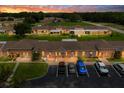 Stunning twilight aerial view of a condo community, enhanced by landscaped grounds and inviting illumination at 4209 Club Cir, Lakeshore, FL 33854