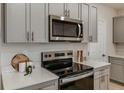 Close up of the modern kitchen with stainless steel microwave and oven at 3747 King Hill Dr, Haines City, FL 33844