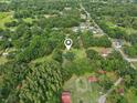 Aerial view of the property surrounded by lush greenery and neighborhood at 5525 Tillman Rd, Lakeland, FL 33810