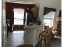 Open kitchen with stainless steel appliances, breakfast bar, and cozy dining area at 9053 Lee Vista Blvd # 1405, Orlando, FL 32829