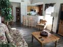 Inviting living room featuring hardwood floors and a cozy sitting area at 9053 Lee Vista Blvd # 1405, Orlando, FL 32829