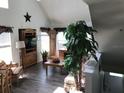 Cozy living room featuring lots of natural light and a large tree at 9053 Lee Vista Blvd # 1405, Orlando, FL 32829
