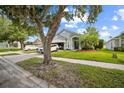 Charming single-story home with well-manicured lawn and mature trees at 4931 Jetton Dr, Orlando, FL 32837