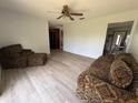 Spacious living area with cozy seating and vinyl floors, ideal for entertaining and relaxing at 3453 Duff Rd, Lakeland, FL 33810