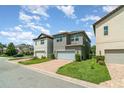 New construction home featuring a brick driveway and pristine landscaping at 9349 Mira Valle Ln, Winter Garden, FL 34787