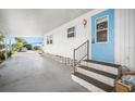 Inviting covered carport with steps to the front door, offering protection from the elements and convenient access to the home at 932 Cassandra Ln, Lakeland, FL 33809
