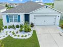 Aerial view of this charming single-story home with its manicured lawn and a two car garage in a lovely neighborhood at 5934 Shingle Creek Rd, Lakeland, FL 33811