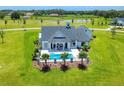 Beautiful home with a private pool, lush backyard, and meticulously landscaped areas at 12902 Sw 138Th Loop, Dunnellon, FL 34432