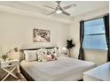 Cozy bedroom featuring natural light, modern furnishings, and a relaxing atmosphere at 4751 Clock Tower Dr # 307, Kissimmee, FL 34746