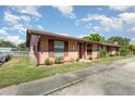 Single-story home featuring mature landscaping and a well-manicured lawn at 89 Fremont Ave # 504, Daytona Beach, FL 32114