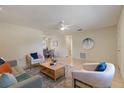 Inviting living room featuring a comfortable sofa, stylish chairs, and neutral decor at 13449 Ashley Ct, Grand Island, FL 32735