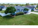 A charming single-story home with a well-maintained lawn, mature tree, and a light blue exterior paint at 2869 Hickory Ridge Dr, Lakeland, FL 33813