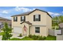 Two-story home showcasing black shutters, well-kept lawn, and inviting curb appeal at 2175 Old Mining Rd, Lakeland, FL 33801