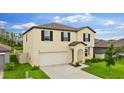 Attractive two-story home with a well-kept lawn and attached two-car garage at 2175 Old Mining Rd, Lakeland, FL 33801