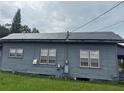 Side view of home with solar panels on the roof at 225 N Palmetto Ave, Fort Meade, FL 33841