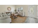 Bright living room featuring modern furniture, neutral tones, and a stylish decor, creating a welcoming ambiance at 5233 Los Palma Vista Dr, Orlando, FL 32837
