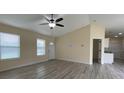 Living room showcasing a ceiling fan, a front door, and neutral walls for easy customization at 16910 Sw 27 Avenue, Ocala, FL 34473