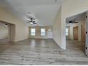 Spacious living room with open layout, ceiling fan, and views into adjacent rooms, creating a welcoming atmosphere at 16910 Sw 27 Avenue, Ocala, FL 34473