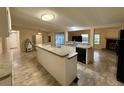 Spacious kitchen with island seating and open layout connecting to living areas at 4861 Myrtle View N Dr, Mulberry, FL 33860