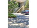 Inviting two-story condo building with black shutters, mature landscaping, and convenient parking at 223 Windsor St # 6, Lakeland, FL 33803