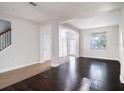 Spacious living room boasting hardwood floors and an abundance of natural light at 10084 Moss Rose Way, Orlando, FL 32832