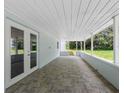 Inviting covered patio with access to backyard, creating a seamless indoor-outdoor living experience at 2440 S Wallace Rd, Bartow, FL 33830