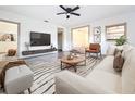 Bright living room with a modern design, featuring hard wood floors and stylish furniture at 1938 E Fern Rd, Lakeland, FL 33801