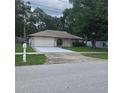 Charming home with attached garage and front yard at 204 Madison St, Minneola, FL 34715