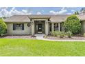 Inviting home entrance with well-kept landscaping and attractive front door at 2925 Deerbrook Dr, Lakeland, FL 33811