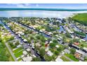 Aerial view showcasing a waterfront community with canals, lush greenery, and stunning water views at 93 Bream St, Haines City, FL 33844