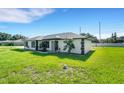 Stylish single-story home with black trim windows on a sunny day at 2151 Groveglen S Ln, Lakeland, FL 33813