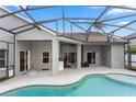 Relaxing screened-in pool area with covered patio, ideal for outdoor entertaining and enjoying the Florida sunshine at 2423 Turnberry Dr, Oviedo, FL 32765