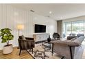 Comfortable living room with modern furniture, a large TV, stylish decor, and sliding glass doors at 5793 Timber Meadow Way, St Cloud, FL 34771