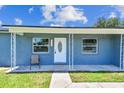Inviting front porch with a chair, providing a welcoming entrance to the home at 2902 Wheeler St, Bartow, FL 33830