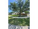 Serene view of home surrounded by mature trees and green lawns at 3802 Bryston Dr, Orlando, FL 32822