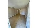 Spacious living room with neutral paint and tile flooring, ready for personalization at 3802 Bryston Dr, Orlando, FL 32822