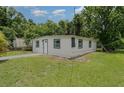 Cozy home featuring fresh paint, a well-maintained lawn, and a welcoming entrance at 833 N Suwannee Ave, Lakeland, FL 33815