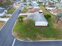 Aerial view of home featuring lush lawn and easy access to neighborhood streets at 1074 Canary S Cir, Lakeland, FL 33809