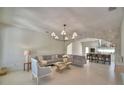 Inviting living room featuring modern decor, open floor plan, and seamless connection to the kitchen at 359 Terminal Ave, Polk City, FL 33868