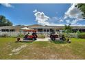 This home includes a fenced backyard and has room for a golf cart at 4709 Club Cir, Lakeshore, FL 33854