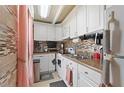 This home features a compact kitchen with lots of storage at 4709 Club Cir, Lakeshore, FL 33854