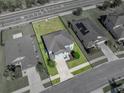 Aerial view of a beautiful two-story home with manicured lawn, fenced yard, and a convenient location at 5660 Elsinore Way, Lakeland, FL 33805