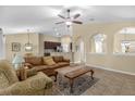 Inviting living room with archways, tile flooring, and a comfortable seating area at 1111 Bassano Way, Orlando, FL 32828