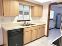 Kitchen features light wood cabinets, tile floors and a stainless-steel sink at 8386 Sw 105Th Pl, Ocala, FL 34481