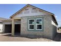 New construction home with concrete block exterior and visible framing and windows at 5722 Cattle Ranch Drive, St Cloud, FL 34771