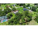 Spacious property featuring lush trees and a private backyard with a pool at 4621 Musket Dr, Lakeland, FL 33810