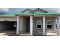 New construction home with concrete block walls and a green roof, showing the home being built at 5724 Haystack Drive, St Cloud, FL 34771