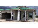 New construction home with concrete block walls and a green roof, showing the home being built at 5724 Haystack Drive, St Cloud, FL 34771