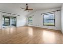 Spacious living room with wood floors, a sliding glass door, and natural light at 1440 12Th St, Clermont, FL 34711